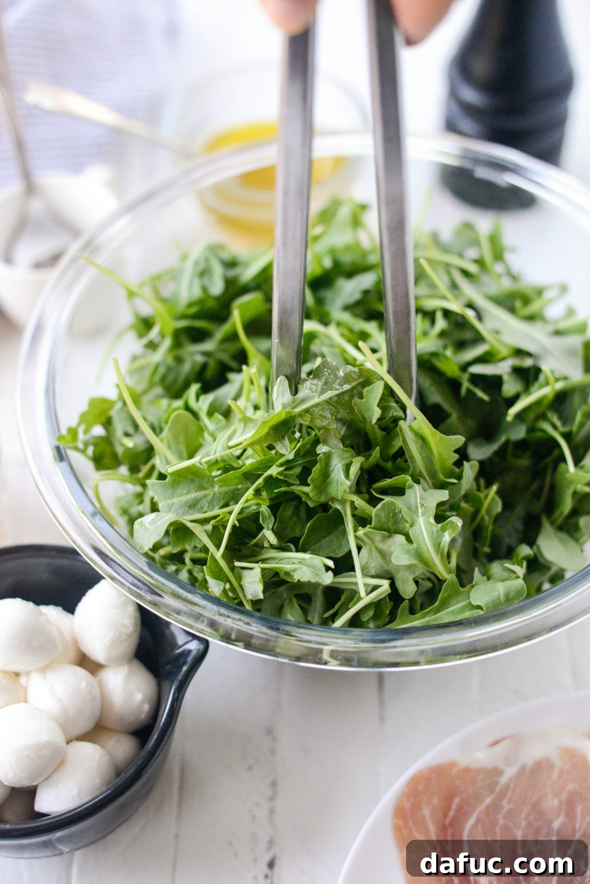 Golden Melon Prosciutto Arugula Fresca 6 Whisking ingredients for Champagne Vinaigrette in a small bowl