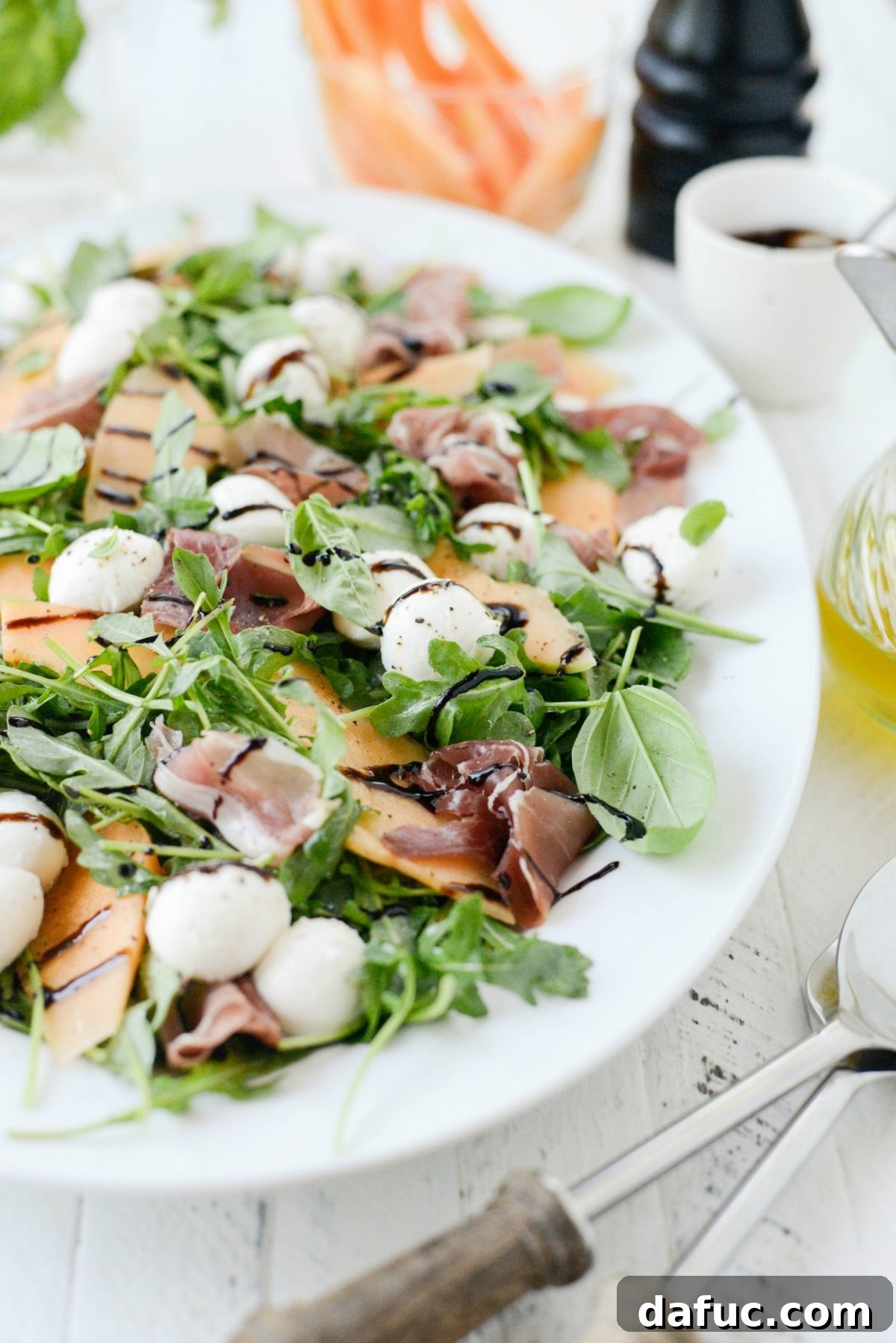 Golden Melon Prosciutto Arugula Fresca 10 Final plated Cantaloupe and Prosciutto Arugula Caprese Salad, ready to be served