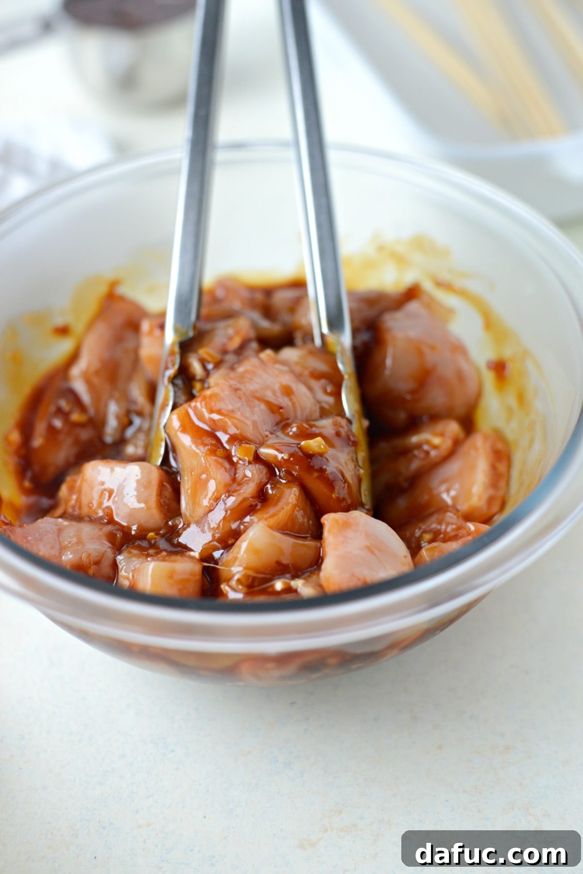 chicken pieces tossed with sauce.