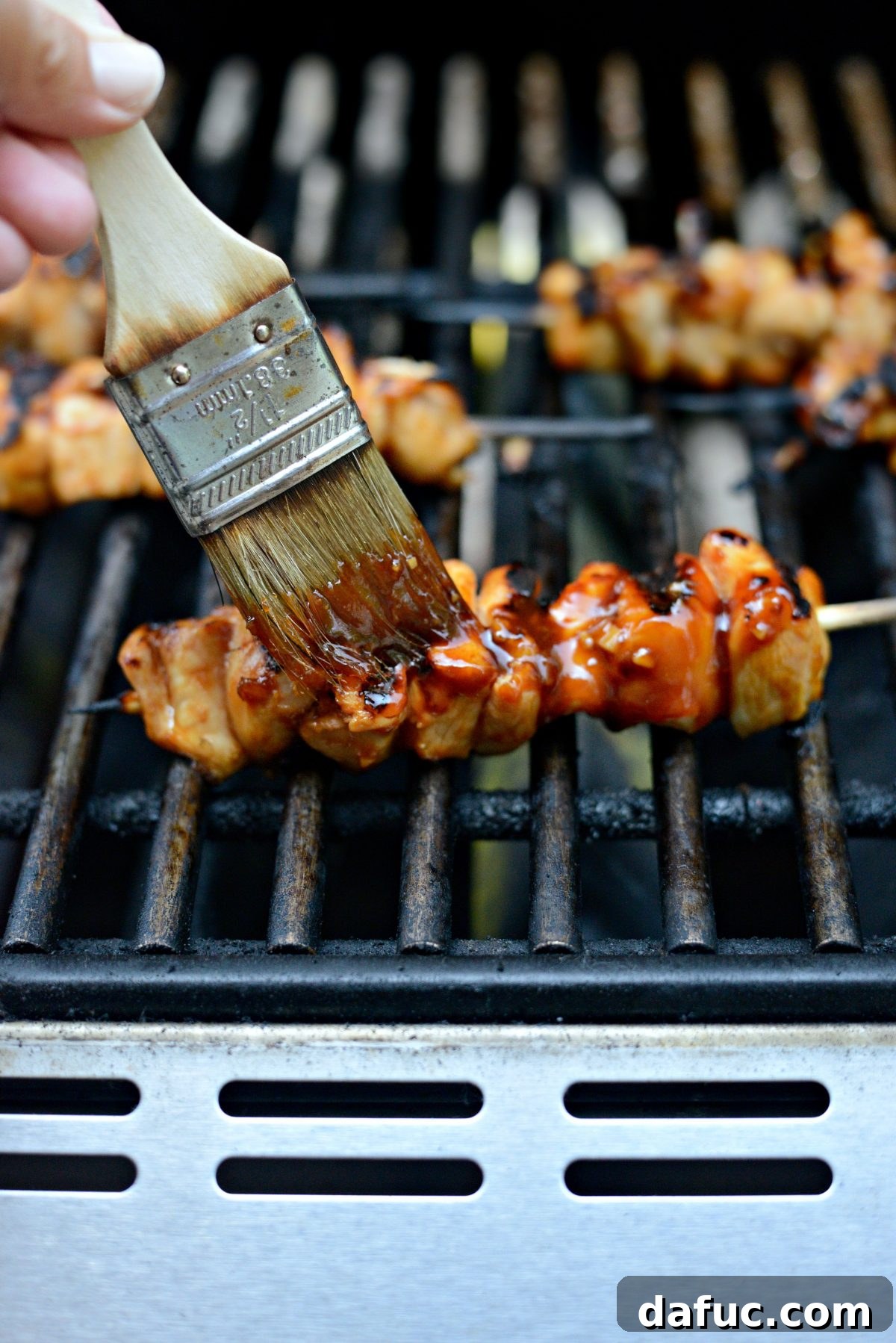 brush grilled chicken skewers with reserved sauce.