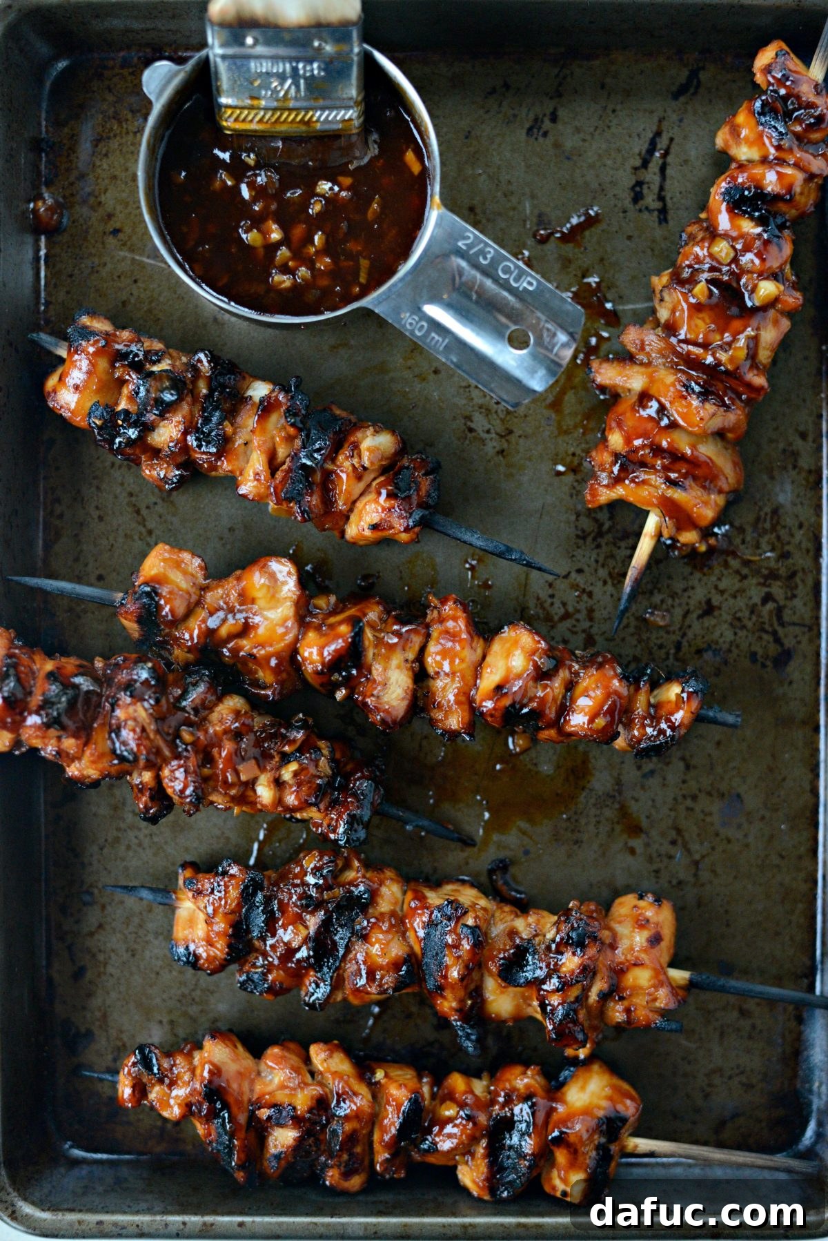 Grilled Sticky Sweet Chicken Skewers on rimmed baking sheet.