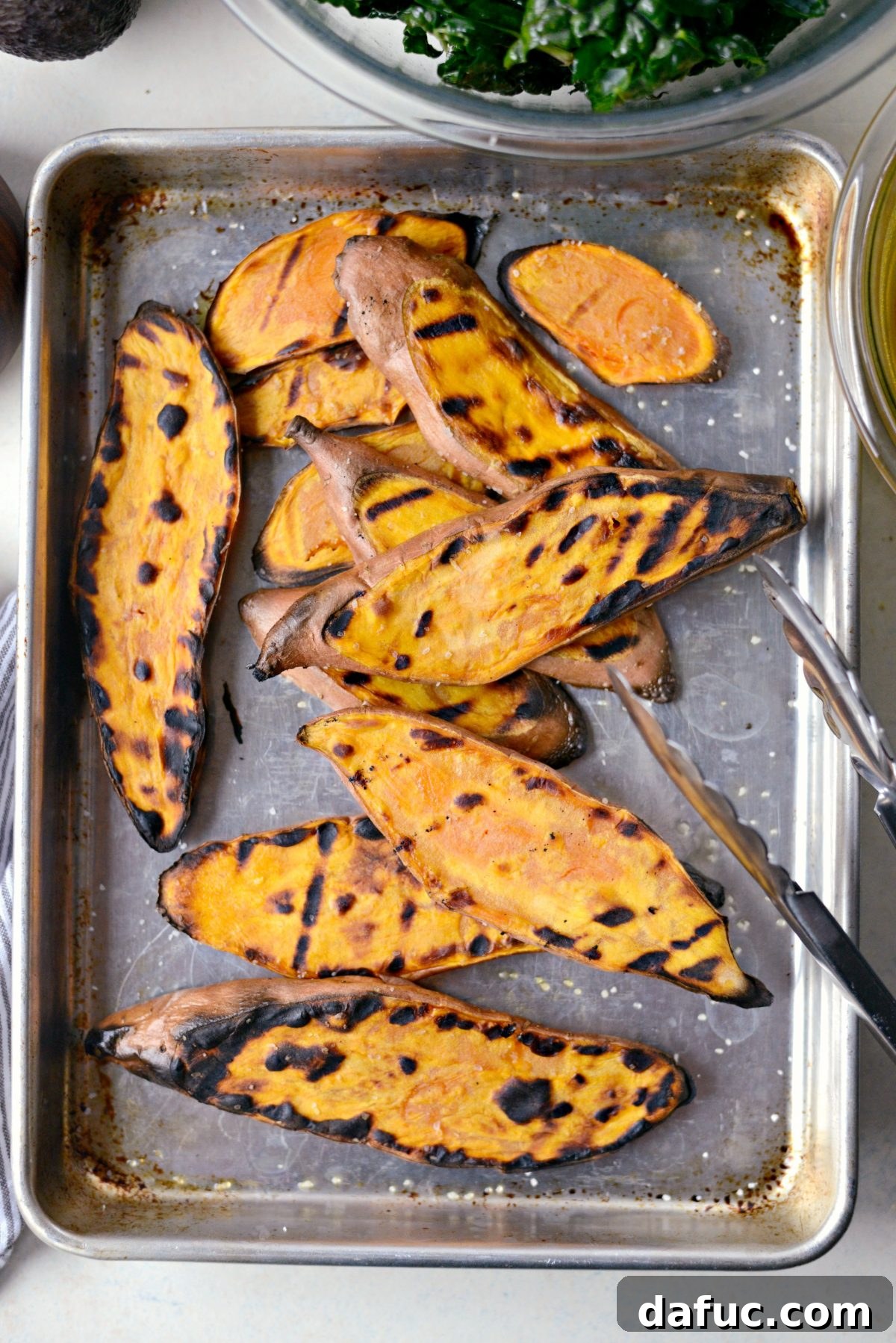 Zen Sweet Potato Bowl 11 grilled sweet potatoes on a rimmed baking sheet.