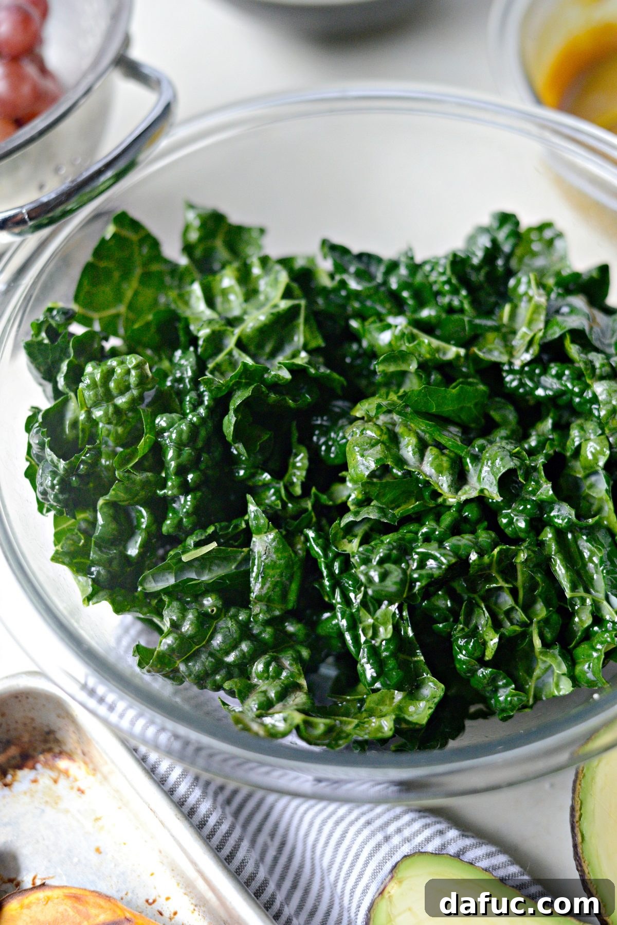 Zen Sweet Potato Bowl 13 massage kale with olive oil and salt.