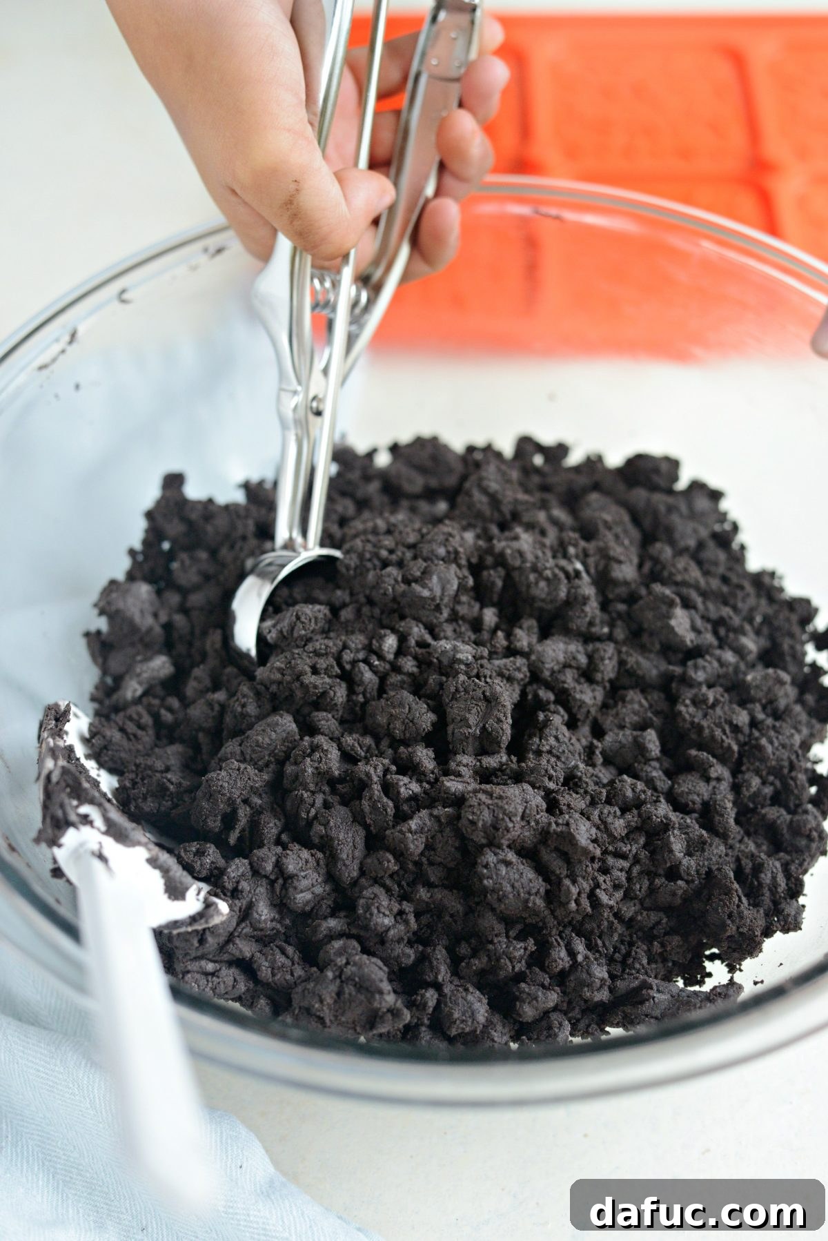 Scooping cookie dough with Pampered Chef scoop