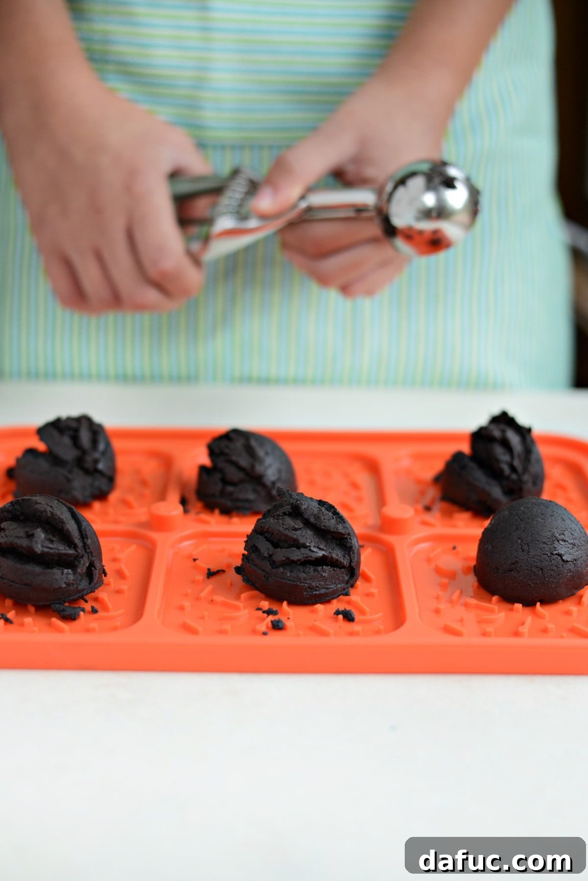 Placing cookie dough into the Pampered Chef Ice Cream Sandwich Maker