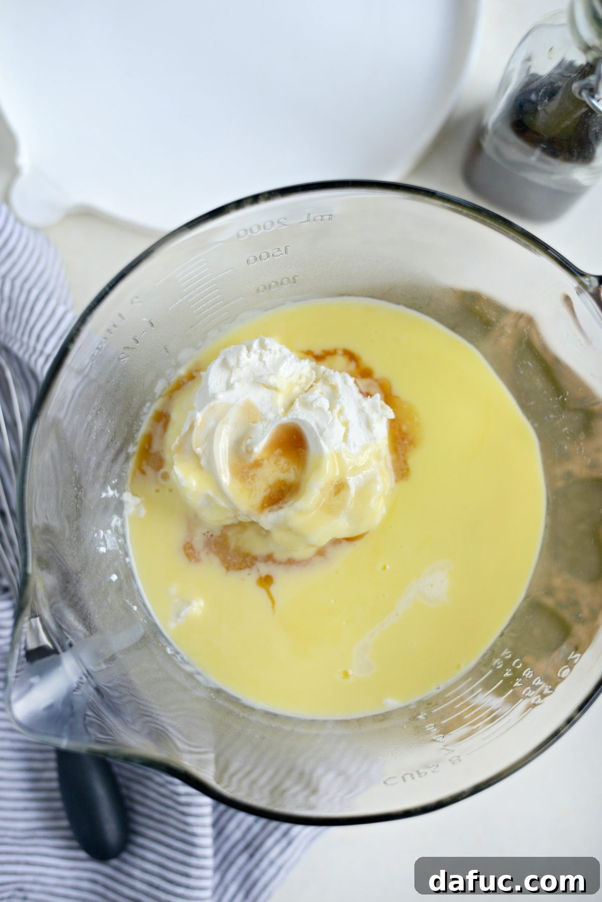 Whisking in mascarpone and vanilla into ice cream base