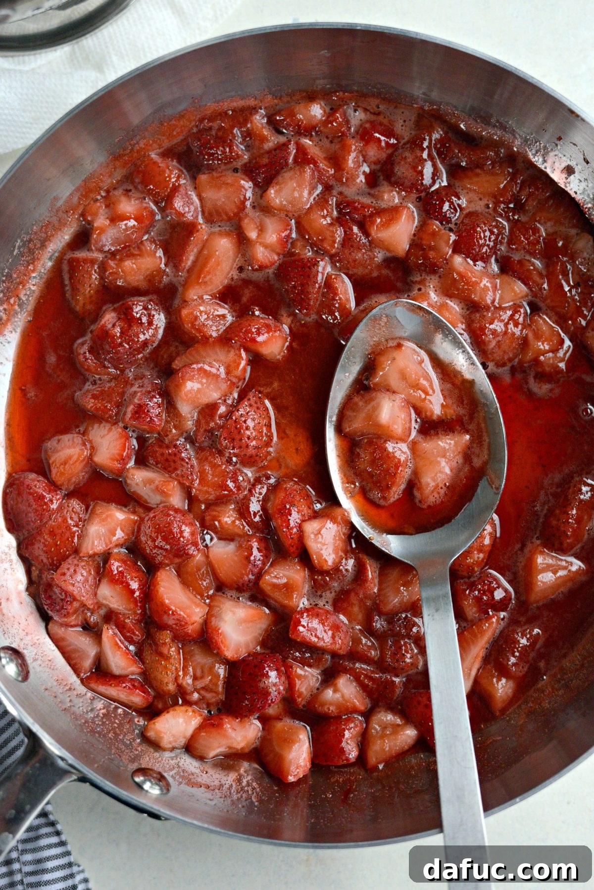 Strawberry sauce simmering on the stove