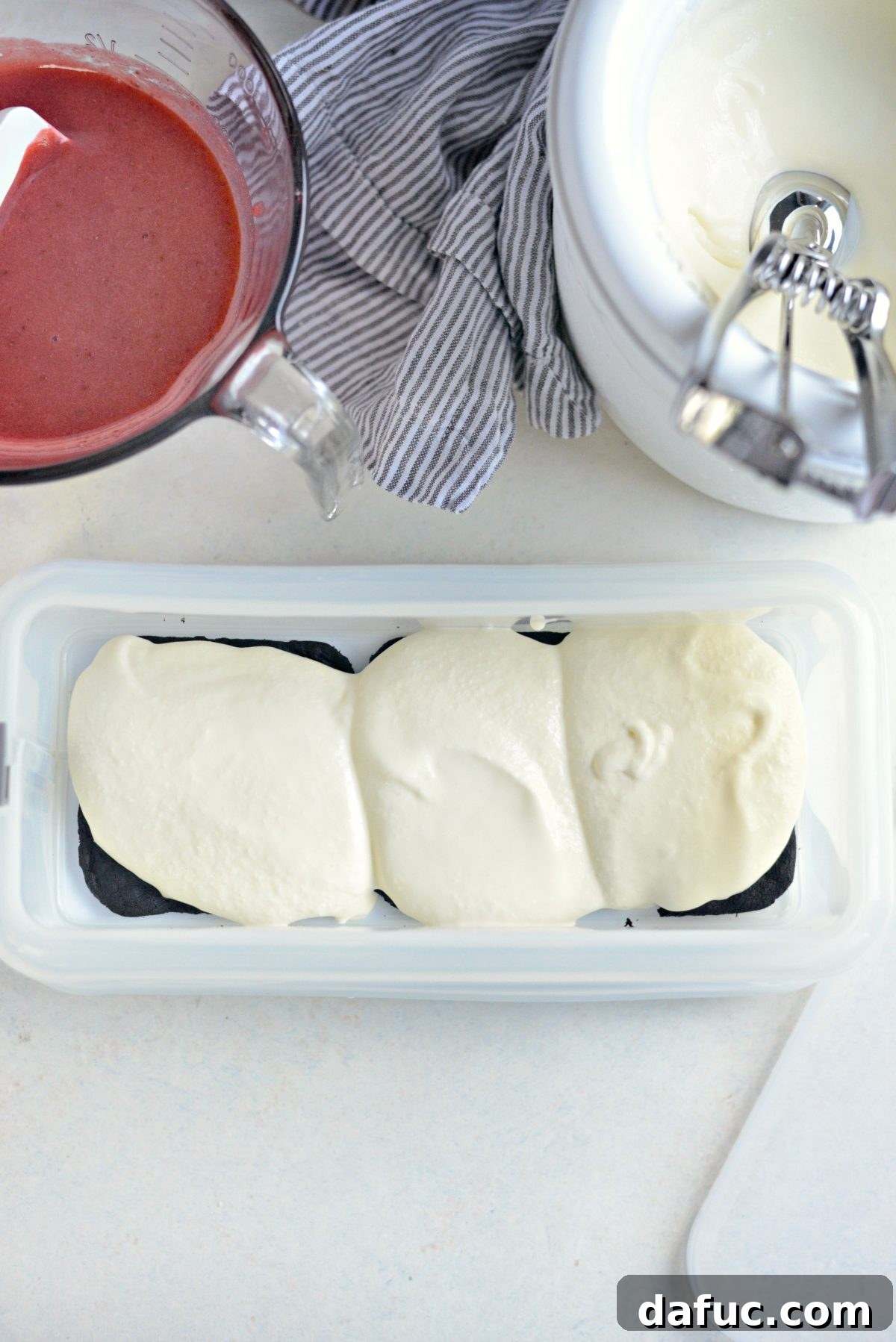 Layering ice cream over cookies