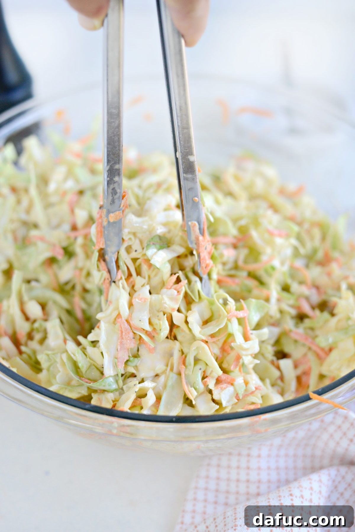 Perfect Classic Coleslaw From Scratch 13 Tossing coleslaw ingredients until evenly coated with dressing