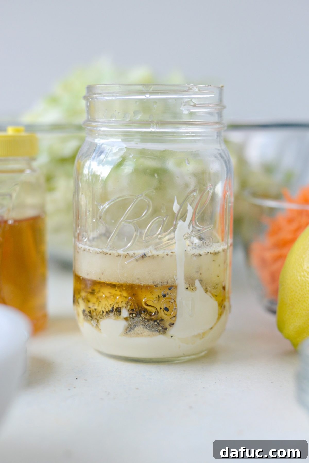 Perfect Classic Coleslaw From Scratch 7 Coleslaw dressing ingredients layered in a jar before mixing