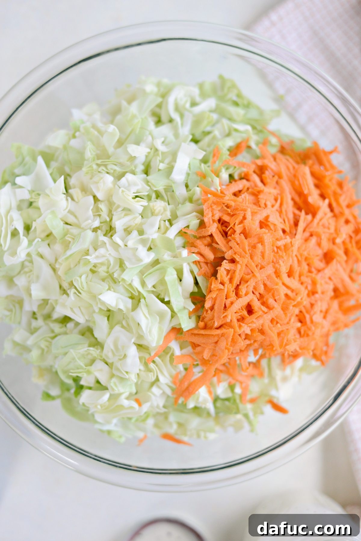 Perfect Classic Coleslaw From Scratch 10 Shredded green cabbage and grated carrots in a large mixing bowl