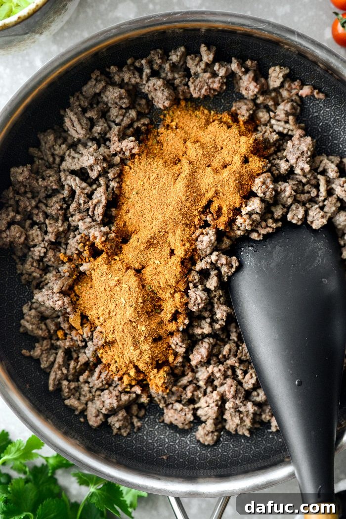 Fiesta Seven Layer Taco Dip 7 Adding Taco Seasoning to Ground Beef