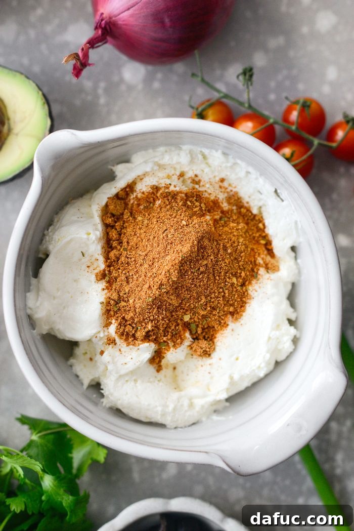 Fiesta Seven Layer Taco Dip 9 Whipped Cream Cheese and Taco Seasoning in a Bowl