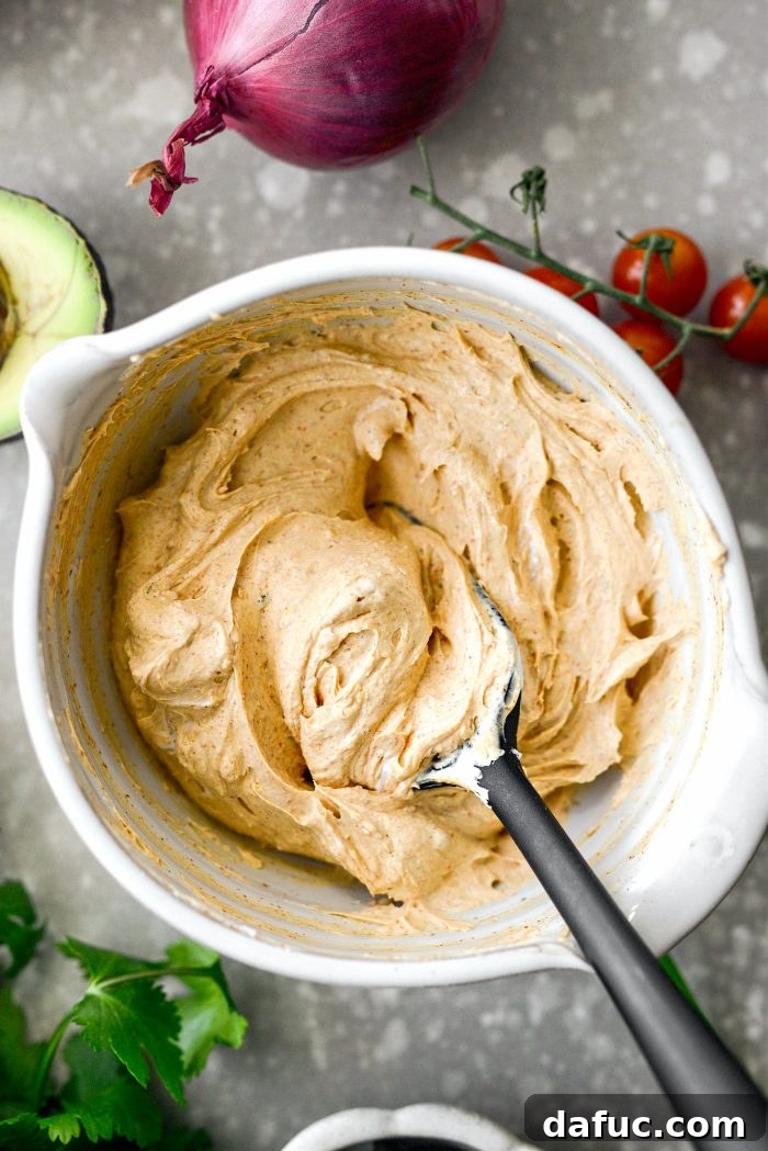 Fiesta Seven Layer Taco Dip 10 Stirring Cream Cheese and Taco Seasoning Together