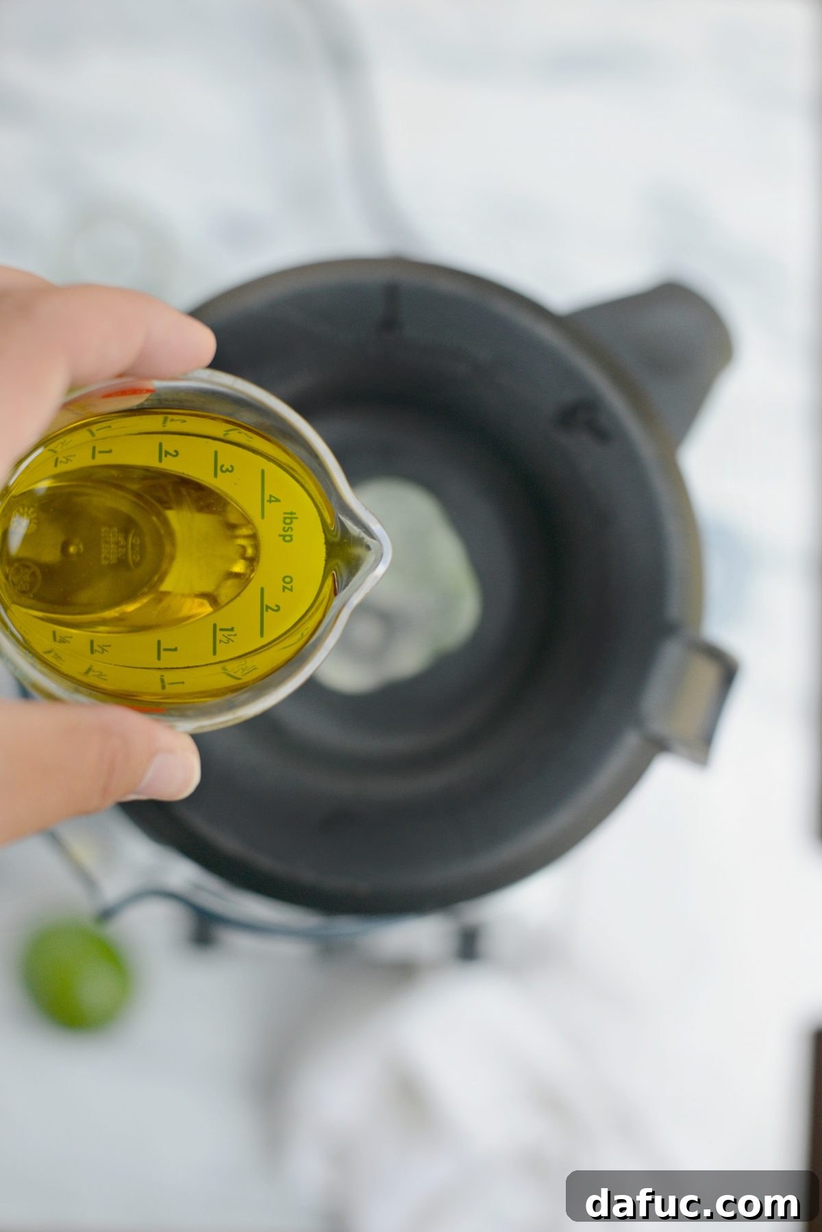 Streaming in olive oil while blending