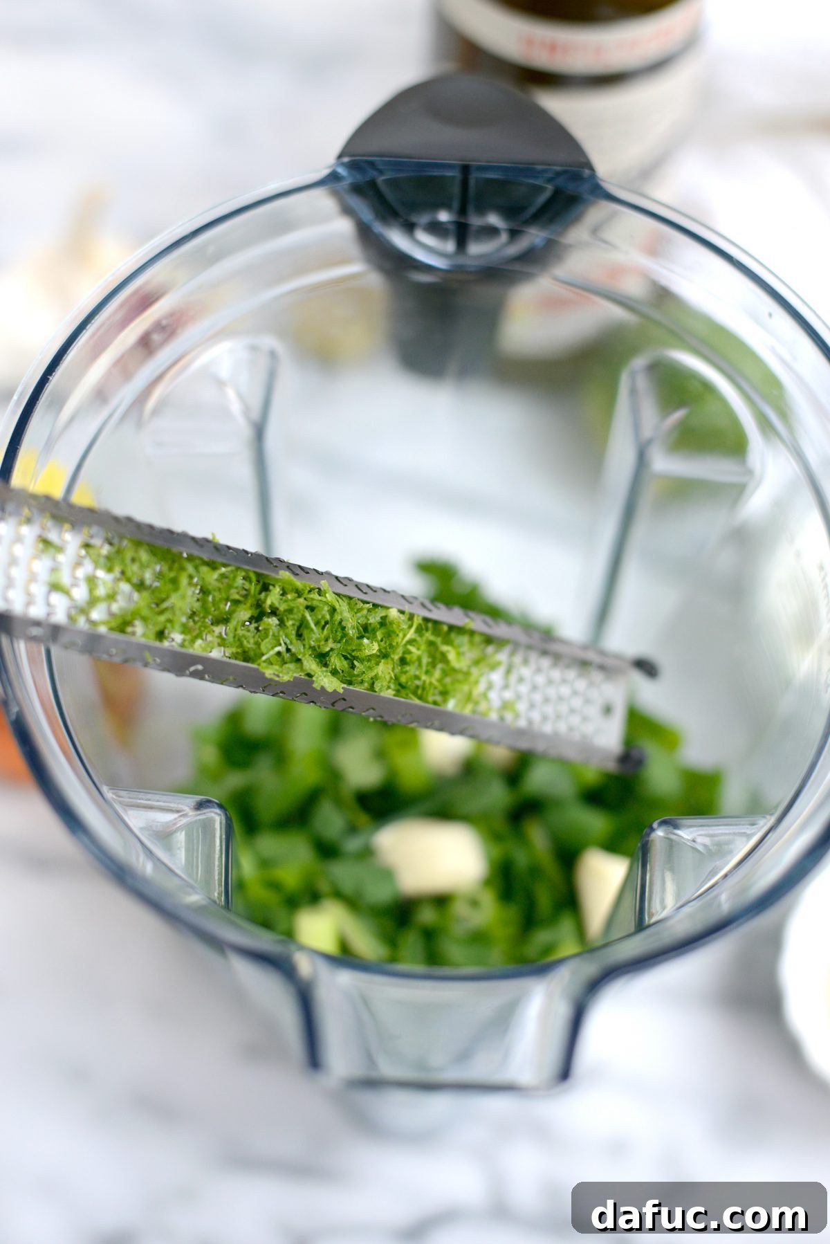 Adding lime zest to dressing ingredients