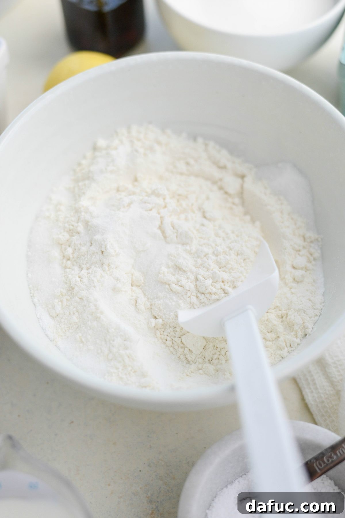 Dry ingredients for cobbler batter in a mixing bowl.