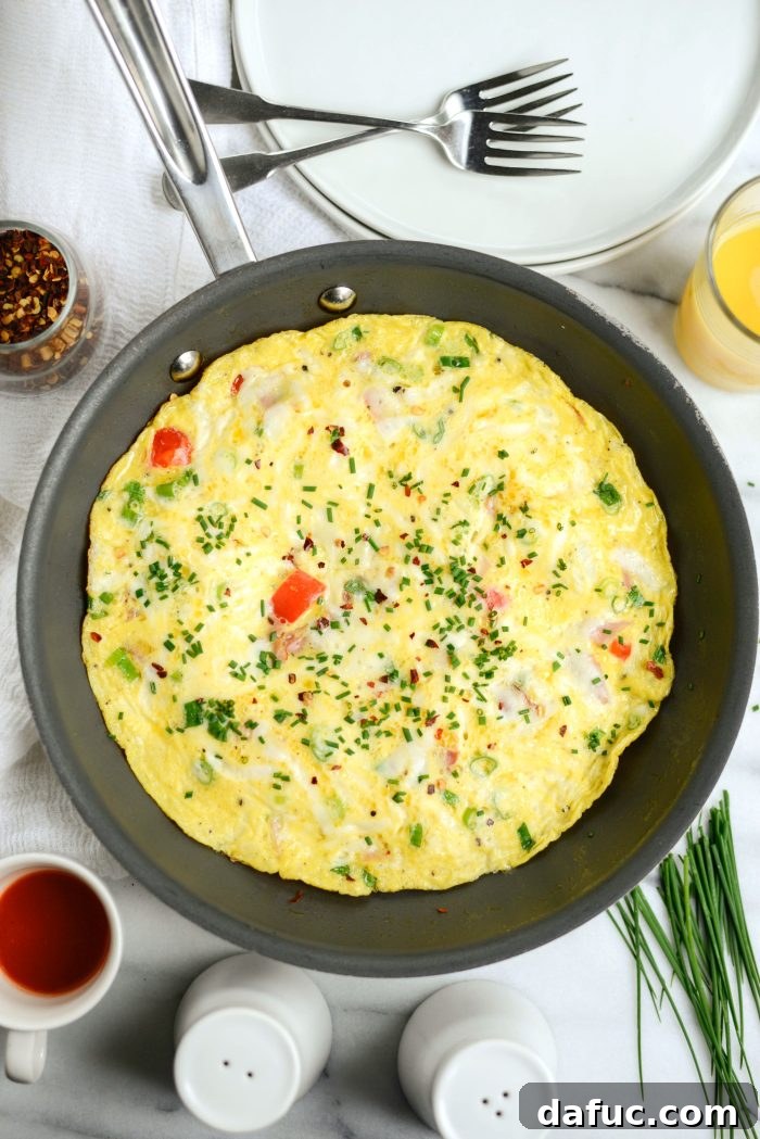 Cowboy Breakfast Frittata 10 Perfectly cooked Western Frittata in a skillet, ready to be served