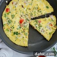 Western Frittata with a golden brown crust and melted cheese