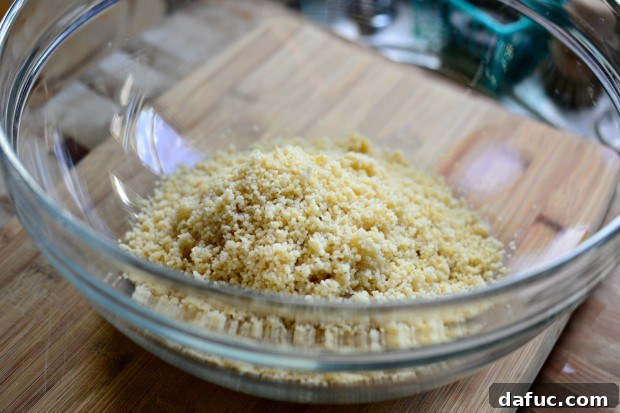 Mastering Fluffy Couscous in Minutes 10 Fluffing cooked couscous with a fork