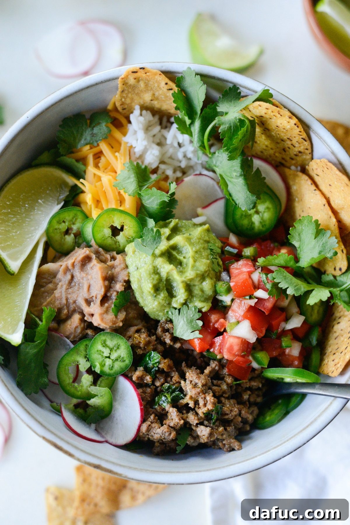 Beefy Bean Burrito Bowls 6 A fully loaded Cheesy Beef and Bean Burrito Rice Bowl ready to be enjoyed