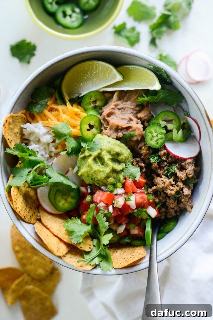 Beefy Bean Burrito Bowls 8 Cheesy Beef and Bean Burrito Rice Bowls served with various fresh toppings