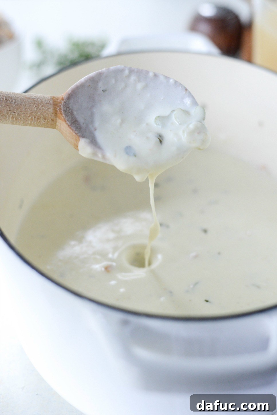 Creamy soup base simmering and thickening in a Dutch oven