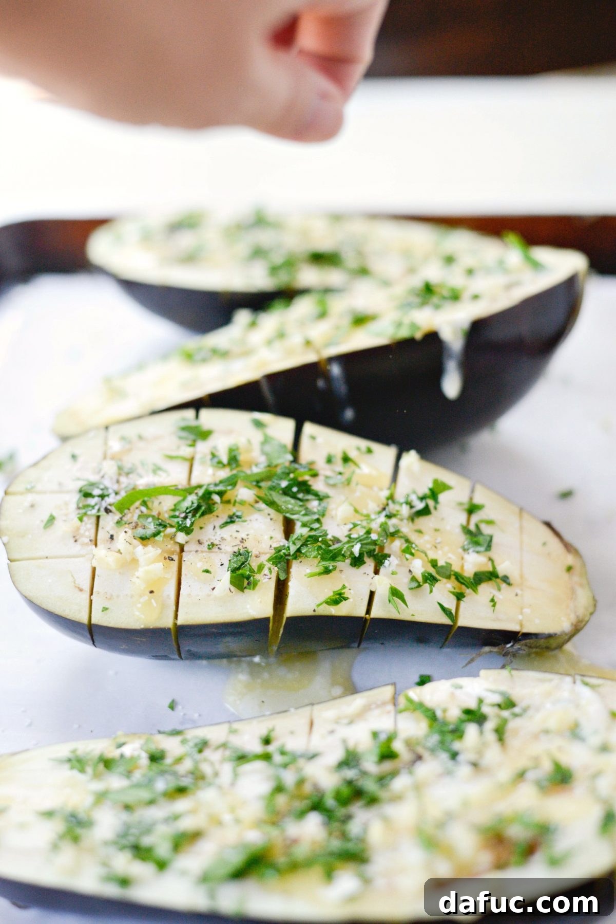 Pecorino Crusted Eggplant Bake 7 sprinkle eggplant with garlic and herbs