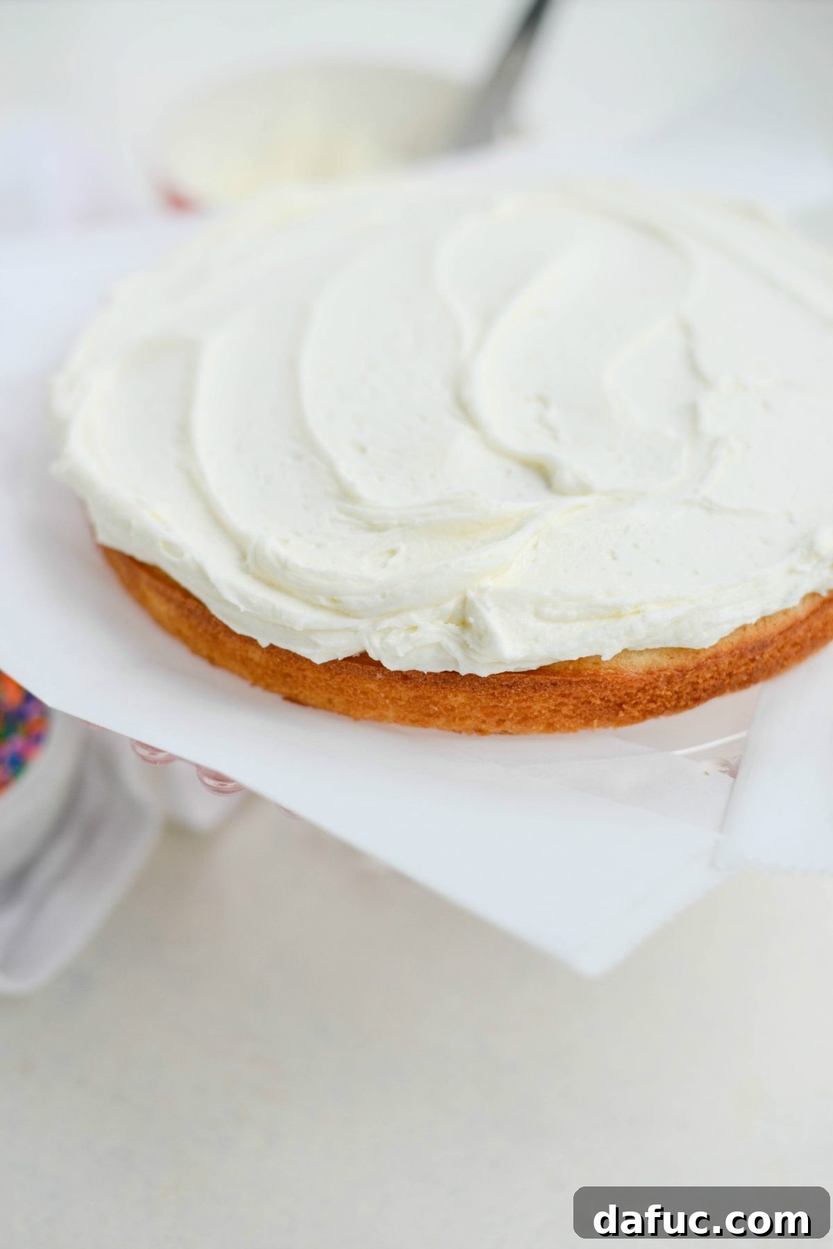Frost the top of the bottom cake layer