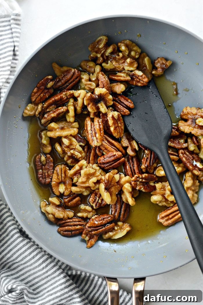Michigan Cherry Orchard Salad 7 Walnuts and pecans heating in maple syrup and salt in a skillet