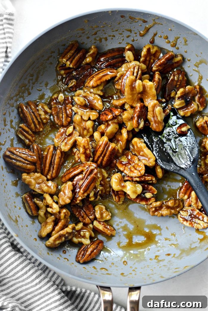 Michigan Cherry Orchard Salad 8 Maple syrup thickening and caramelizing around nuts in a skillet
