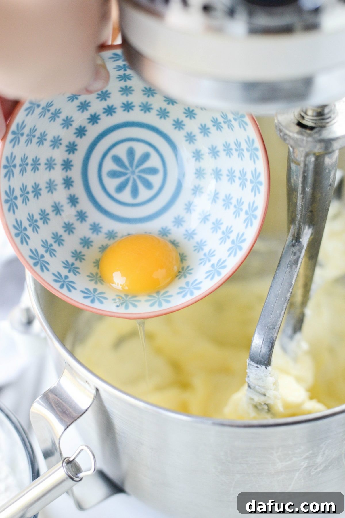 Golden Cinnamon Sugar Delights 7 Adding eggs one at a time to the creamed butter and sugar mixture.