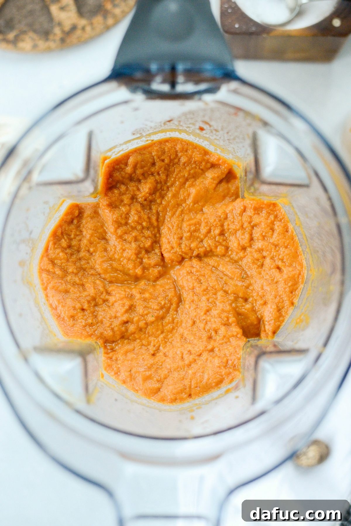Smooth and creamy pureed Roasted Tomato Pumpkin Soup mixture in the blender