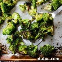 The Best 10-Minute Roasted Broccoli Recipe - A final shot of the roasted broccoli in a serving bowl, ready to be enjoyed.