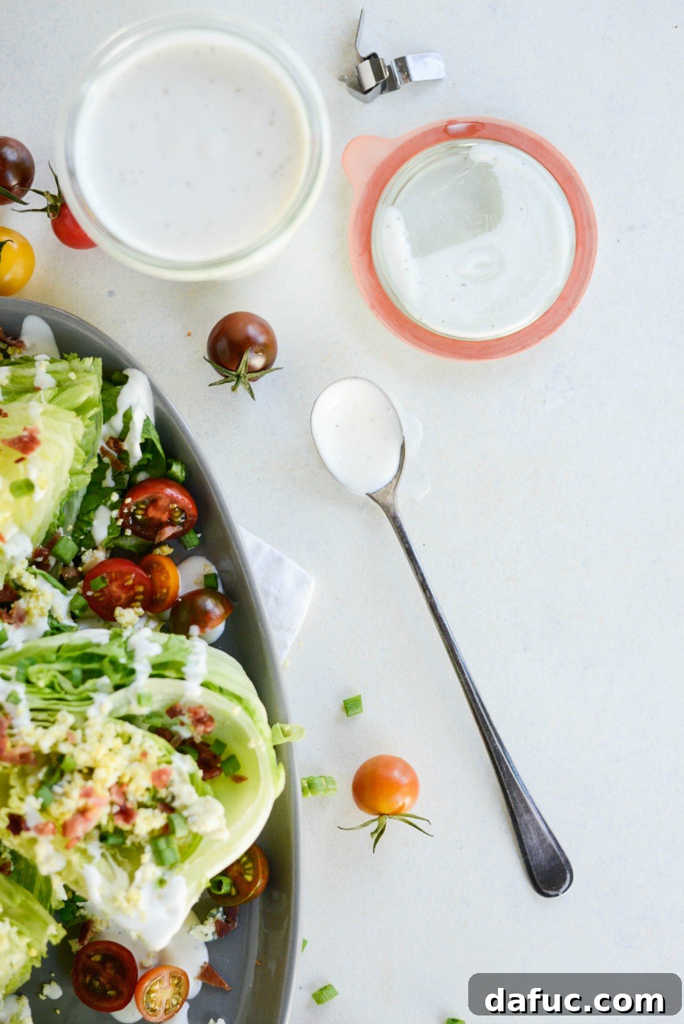 Our Signature Loaded Wedge, Drenched in Peppercorn Buttermilk 14 A wide, artful shot of the complete Loaded Wedge Salad, featuring the vibrant colors and appealing presentation.