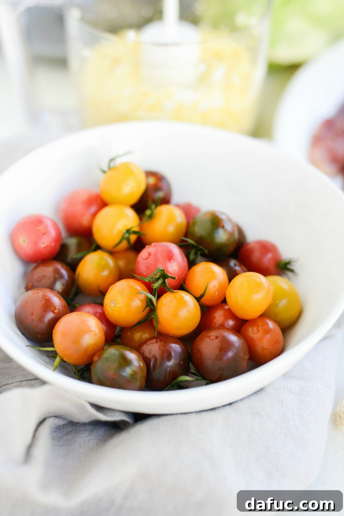 Our Signature Loaded Wedge, Drenched in Peppercorn Buttermilk 6 Fresh, ripe tomatoes in a bowl, ready to be chopped and added to the Loaded Wedge Salad.