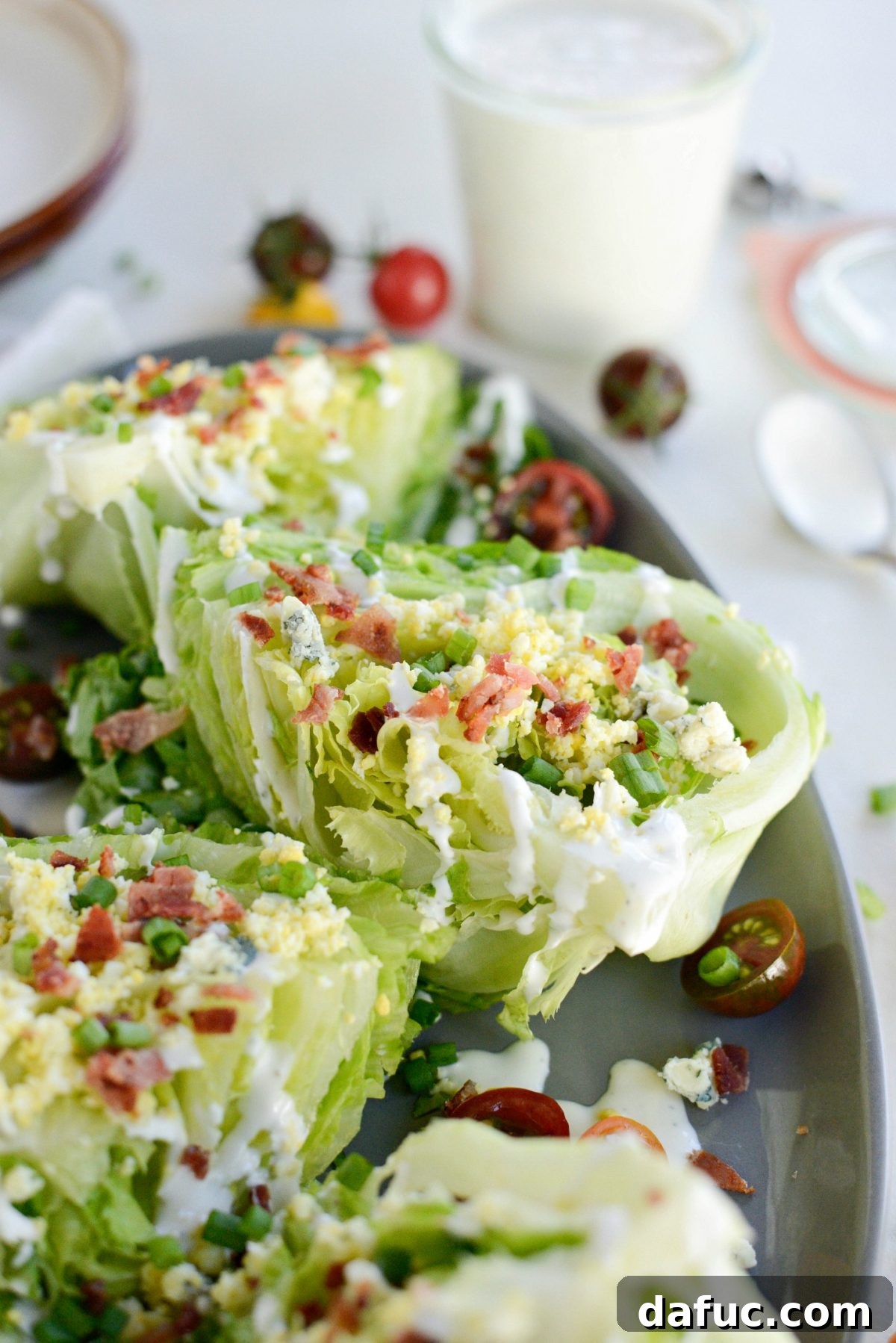 Our Signature Loaded Wedge, Drenched in Peppercorn Buttermilk 10 Overhead shot of the Loaded Wedge Salad, emphasizing the vibrant colors and appealing arrangement of ingredients.