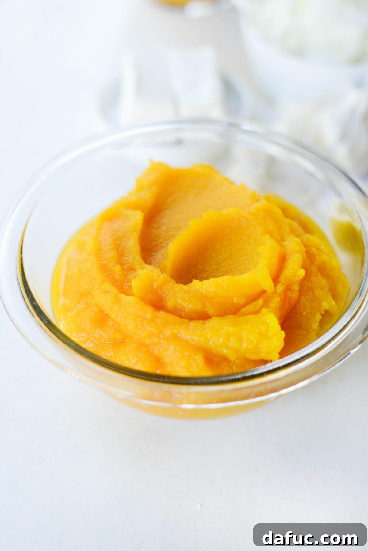 Lush, creamy homemade butternut squash puree in a bowl, ready for use.