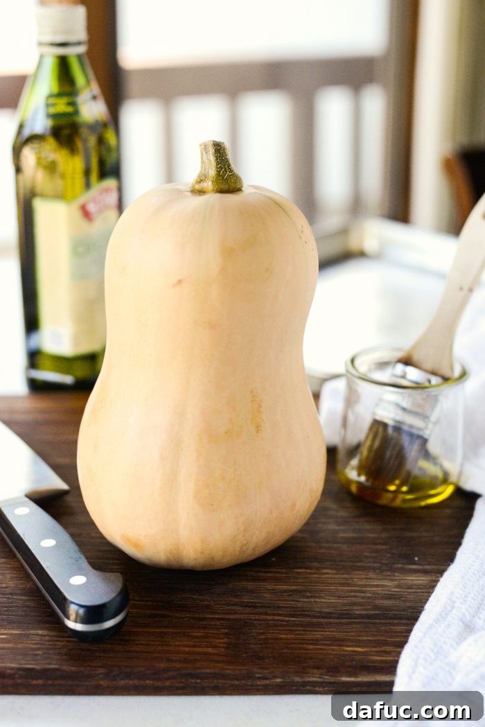 Close-up of a bowl of homemade butternut squash puree with a spoon, ready to be used in various recipes.