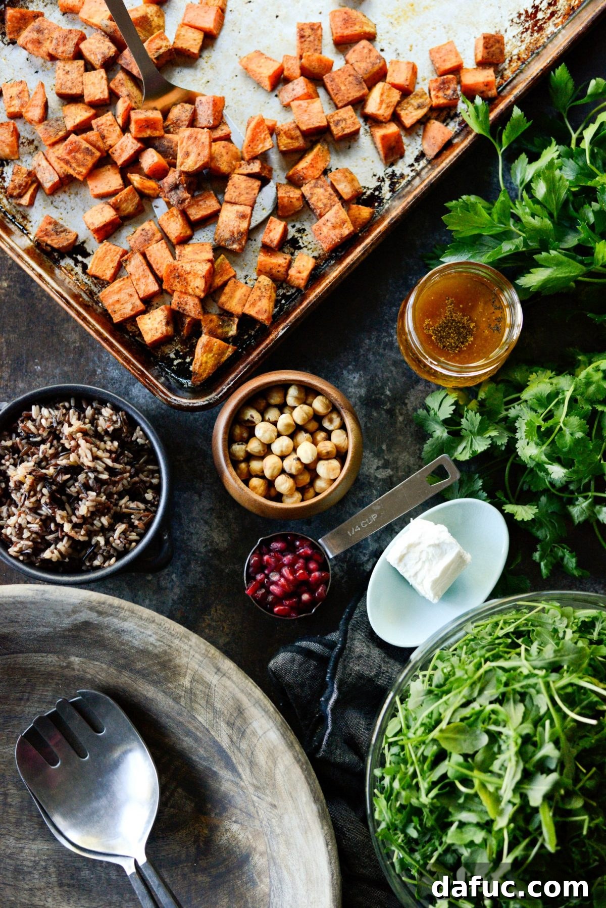 Close-up of Sweet Potato Wild Rice Arugula Salad with pomegranate and goat cheese