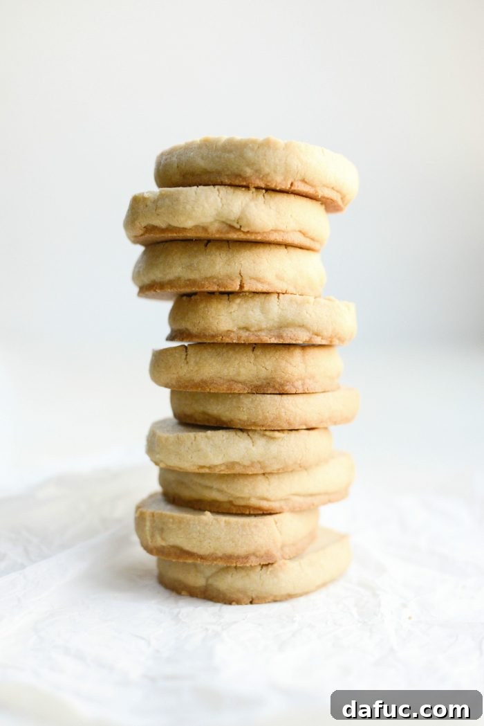Tahini Shortbread Cookies - Golden brown and perfectly round cookies on a cooling rack, showcasing their crisp texture and inviting appearance, ready to be enjoyed.