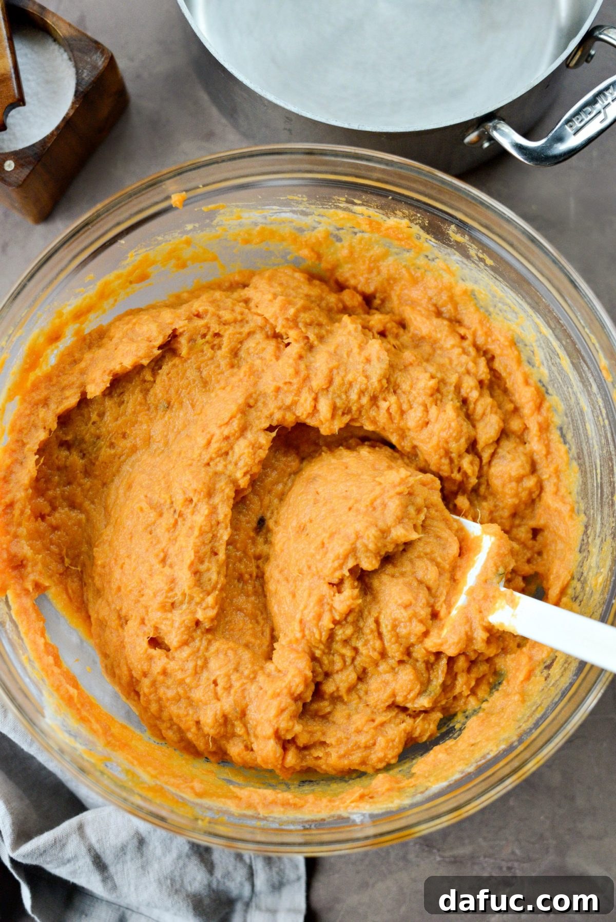 Silky Maple Sweet Potato Mash 11 Mixing the sweet potato mash with an electric hand blender until smooth