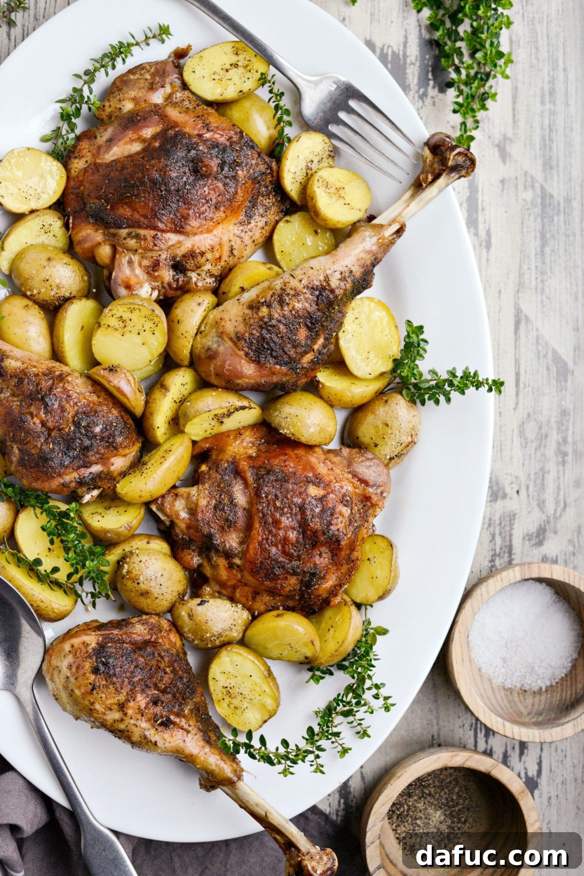 Close-up of a platter showcasing crispy-skinned roasted turkey and potatoes, ready for serving
