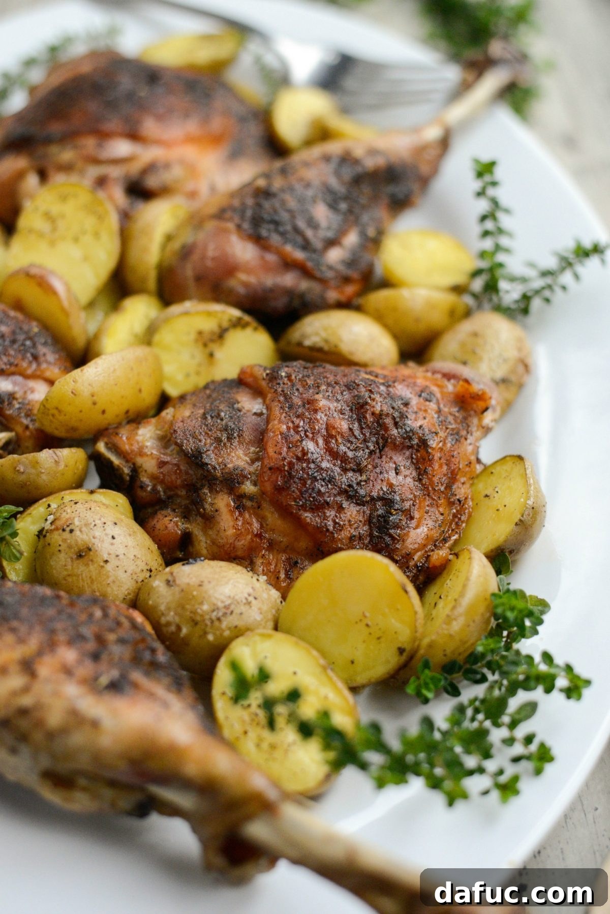 Close up view of a beautifully roasted turkey thigh with crispy, golden-brown skin