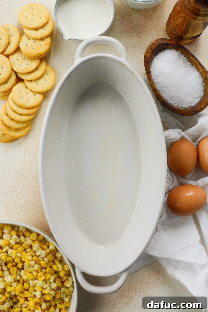 Grease dish and preheat oven - Preparation for Scalloped Corn Casserole