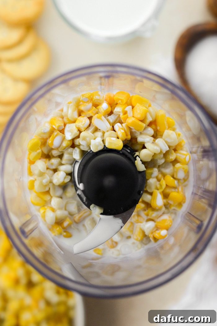 Corn and heavy cream in mini food processor - Making Creamed Corn
