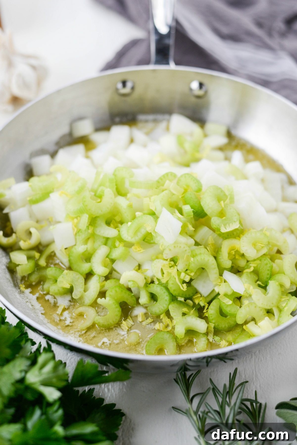 Artisan Herb Sourdough Dressing 7 butter, onions and celery in skillet.