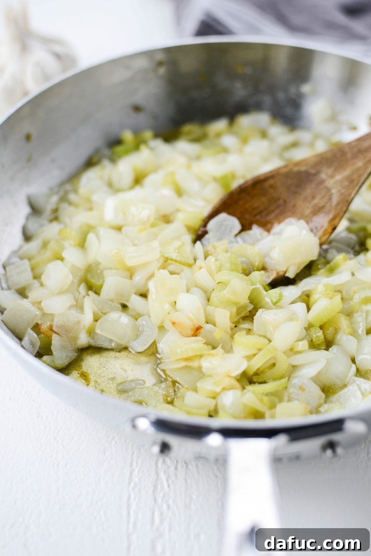 Artisan Herb Sourdough Dressing 8 sautéed onions and celery in skillet.