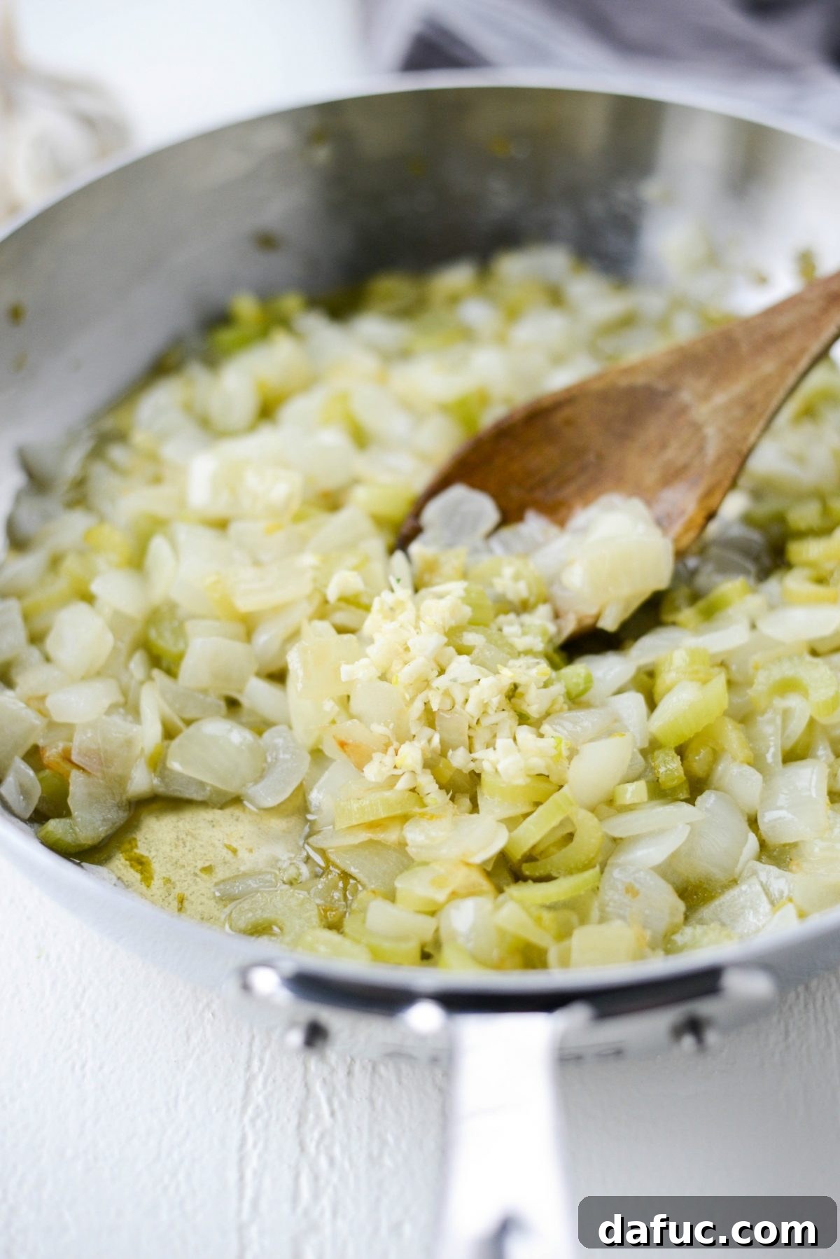 Artisan Herb Sourdough Dressing 9 add garlic to sautéed onions and celery.