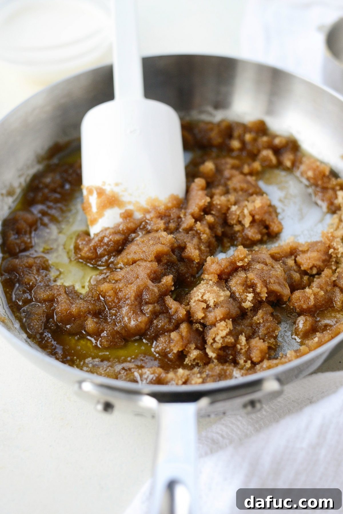 Autumn Spiced Doughnut Bread Pudding 17 Adding light brown sugar to melted butter for the rum sauce base
